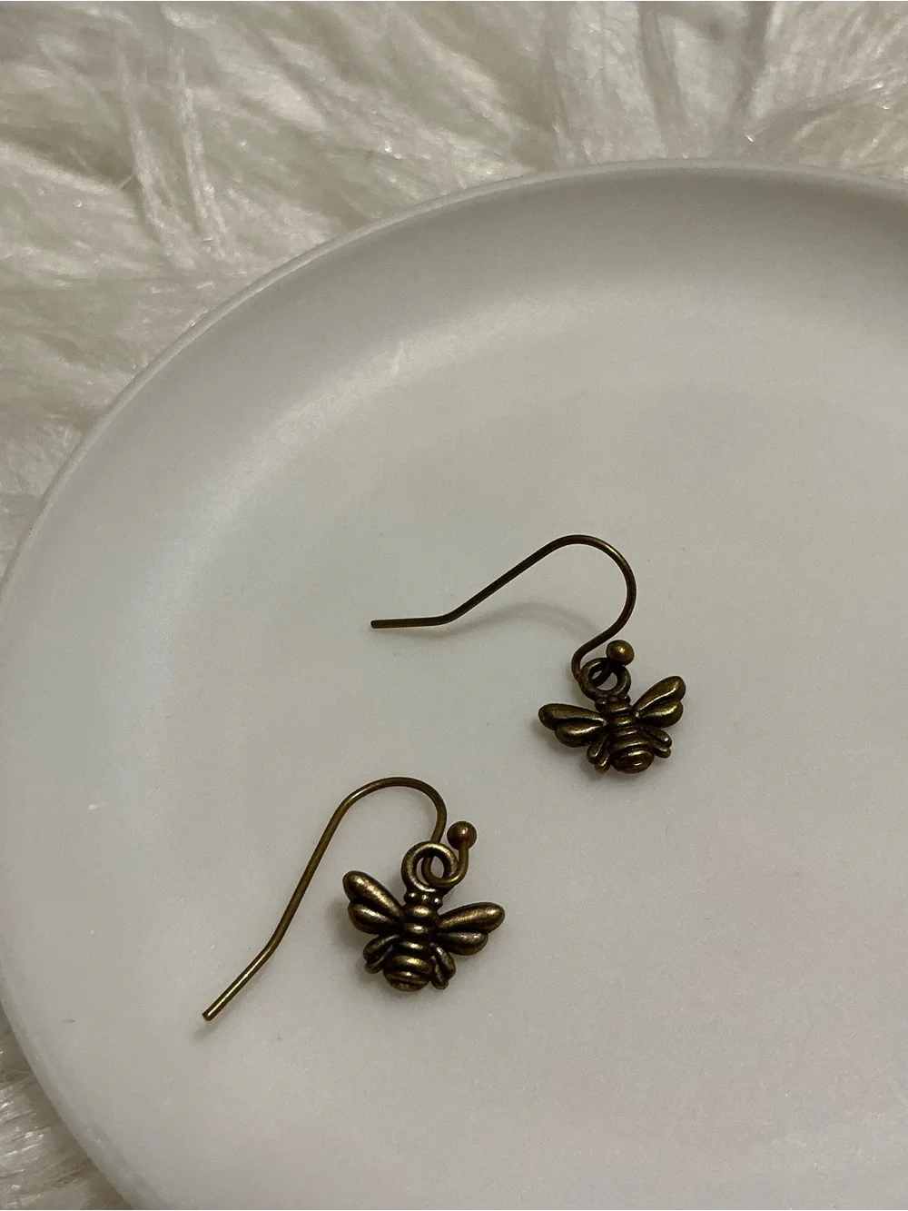 Tiny bronze bee dangle earrings